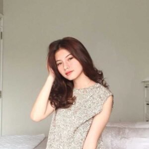 Young woman in a beige dress