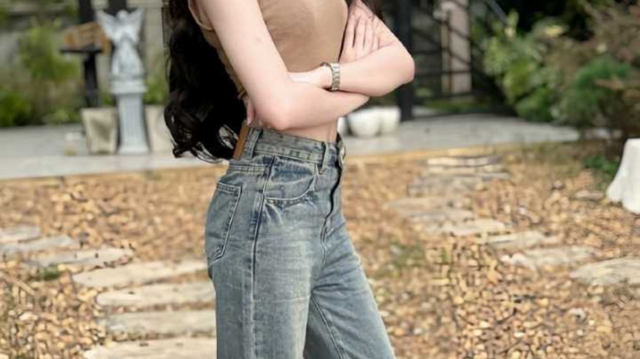 Young woman in casual jeans and top