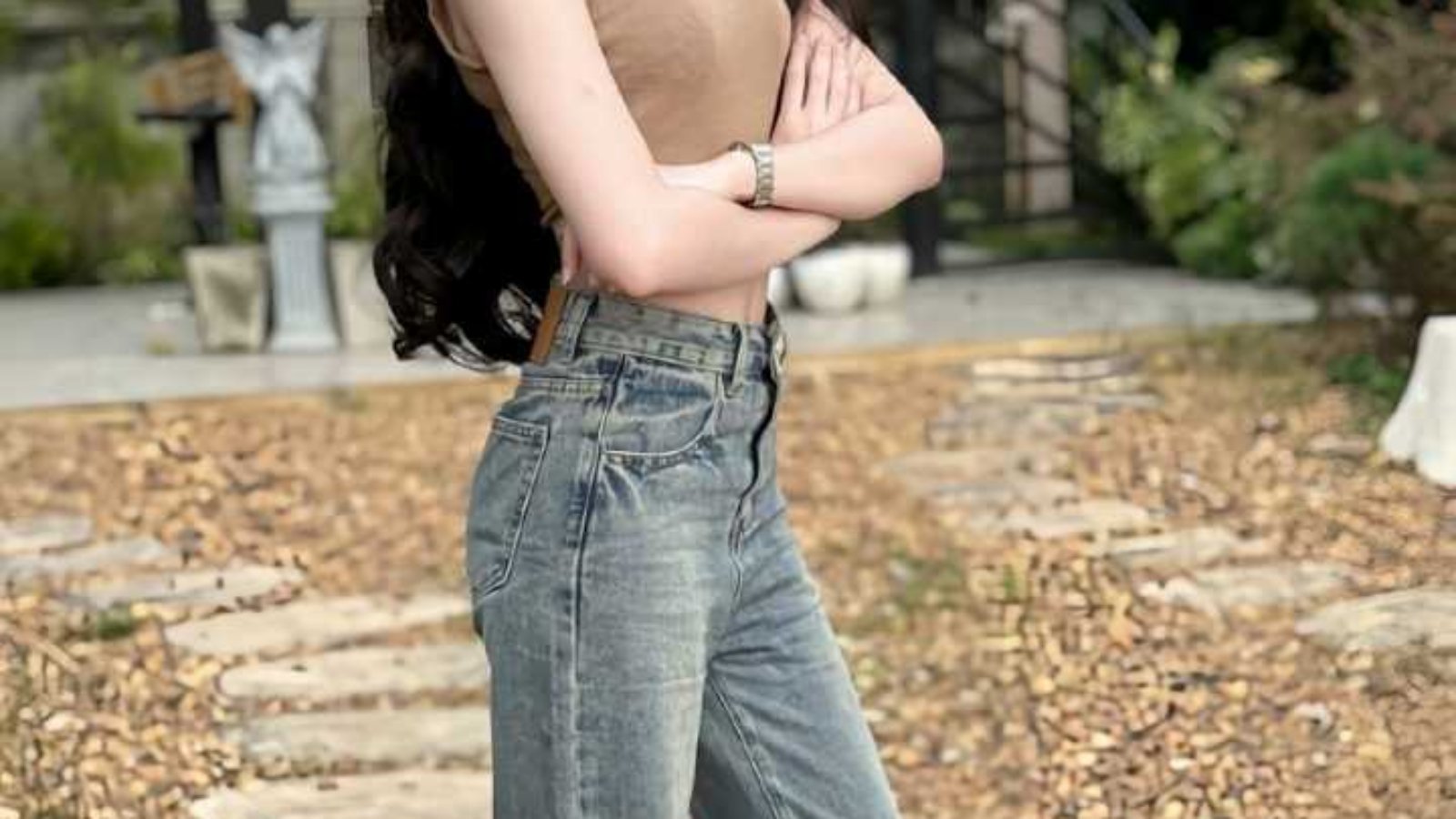 Young woman in casual jeans and top