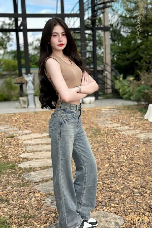 Young woman in casual jeans and top