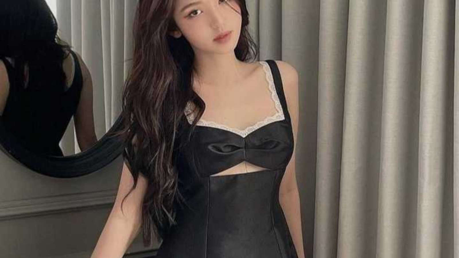 Woman in a black dress.