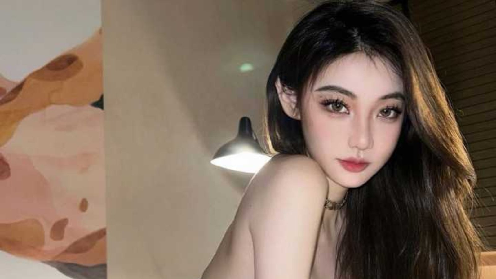 Attractive young woman in a black swimsuit
