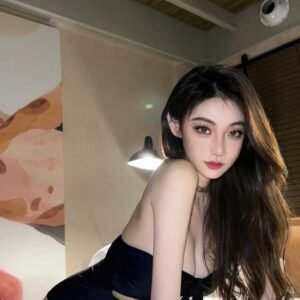Attractive young woman in a black swimsuit