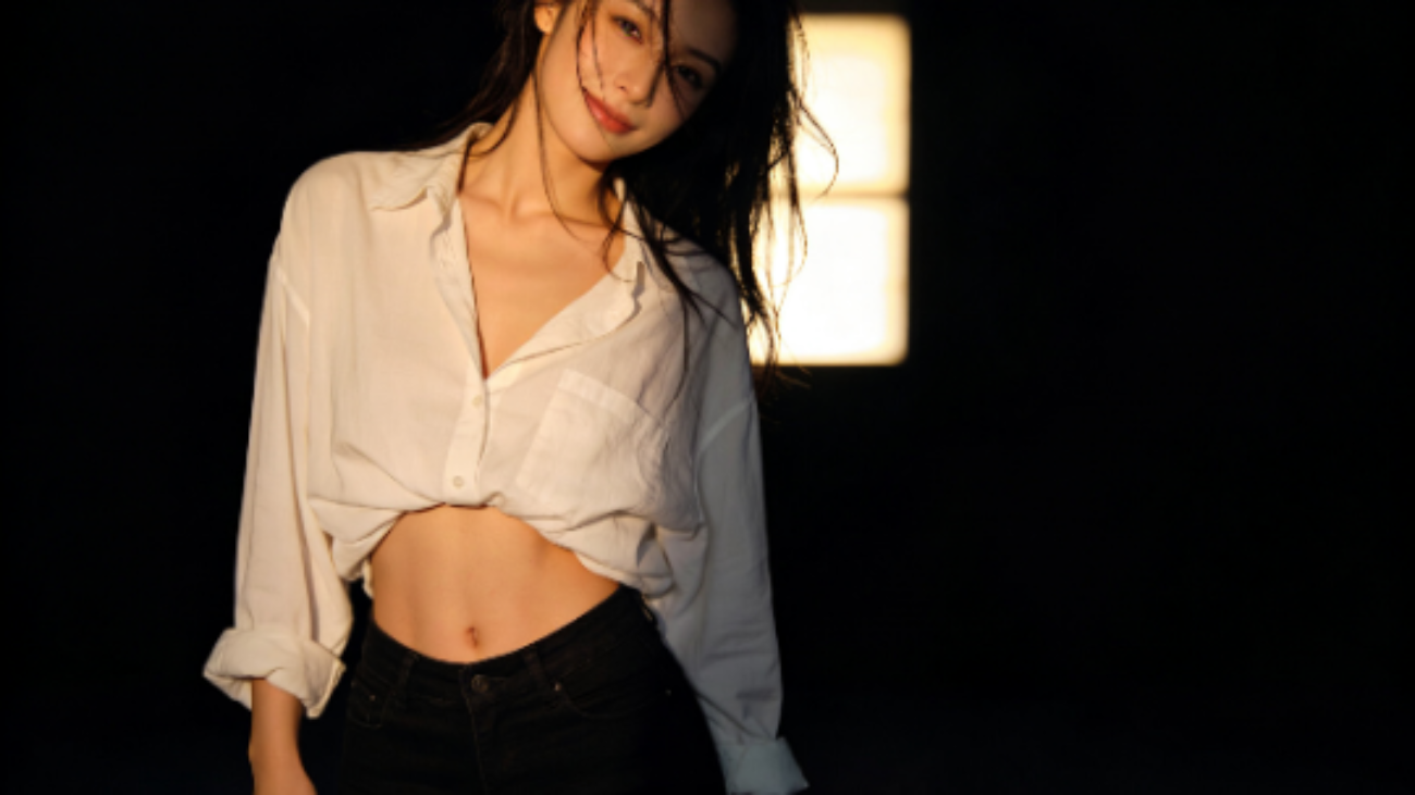 Attractive woman in unbuttoned shirt and shorts. Focus on her physique.