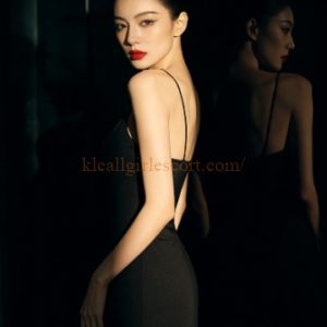 Elegant woman in black dress, red lipstick. KL Escort style.